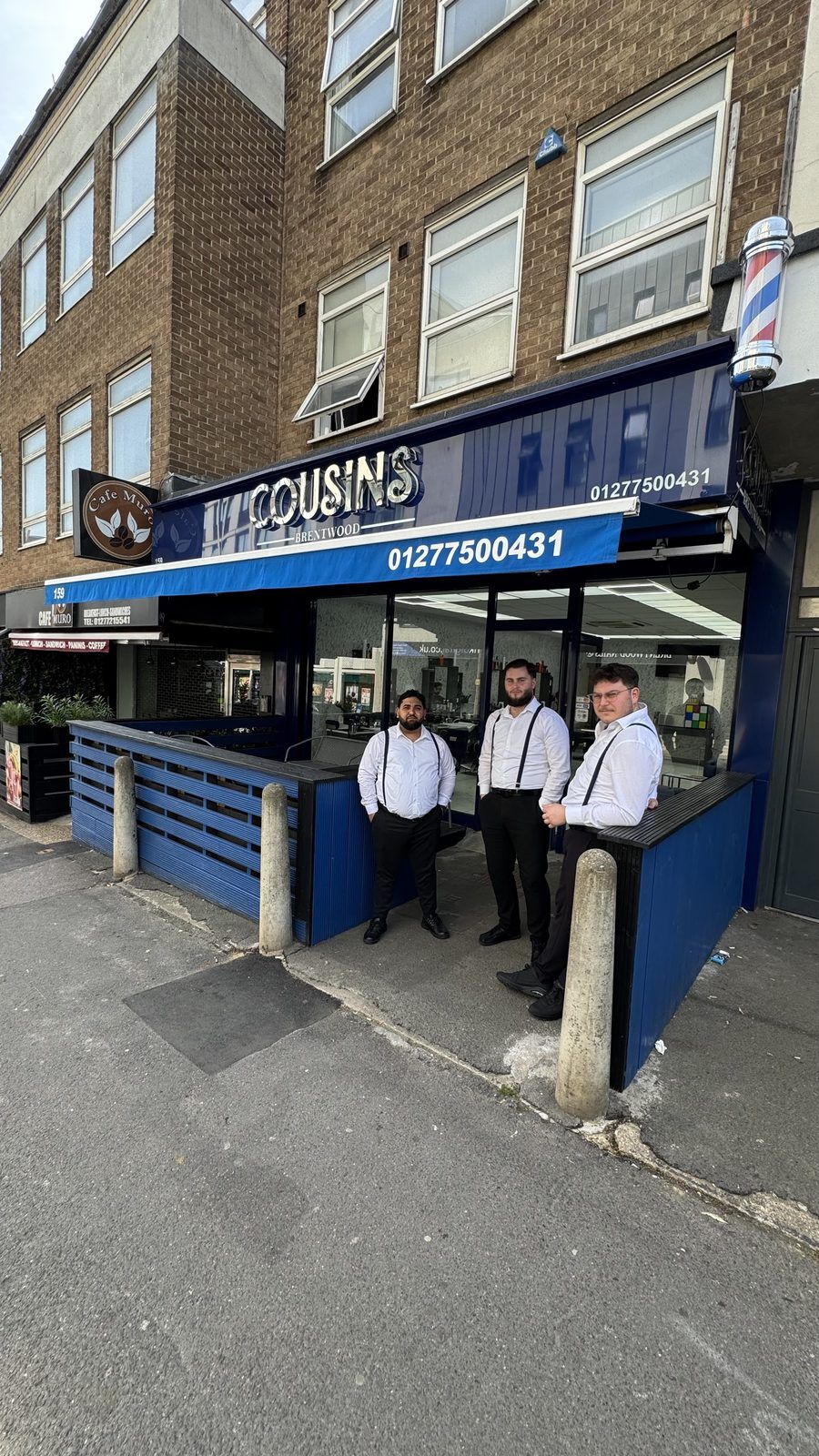 Cousins Brentwood Barbers team outside their shop on Kings Road, Brentwood Essex CM14